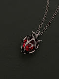 Gothic Dark Style Openwork Heart Red and Blue Glass Heart Pendant